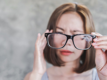 asian-woman-having-headache-from-eyeglasses